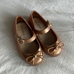Gold mini Melissa maryjanes with bow